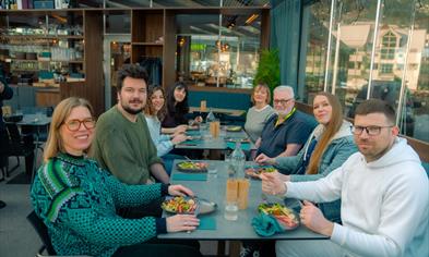 Happy participants on the food tour: A taste of Bergen