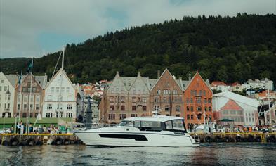 Sailing past the colorful Bryggen harbor in Bergen