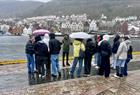 Visiting students take in Bergen in its elements. Strandkaien.